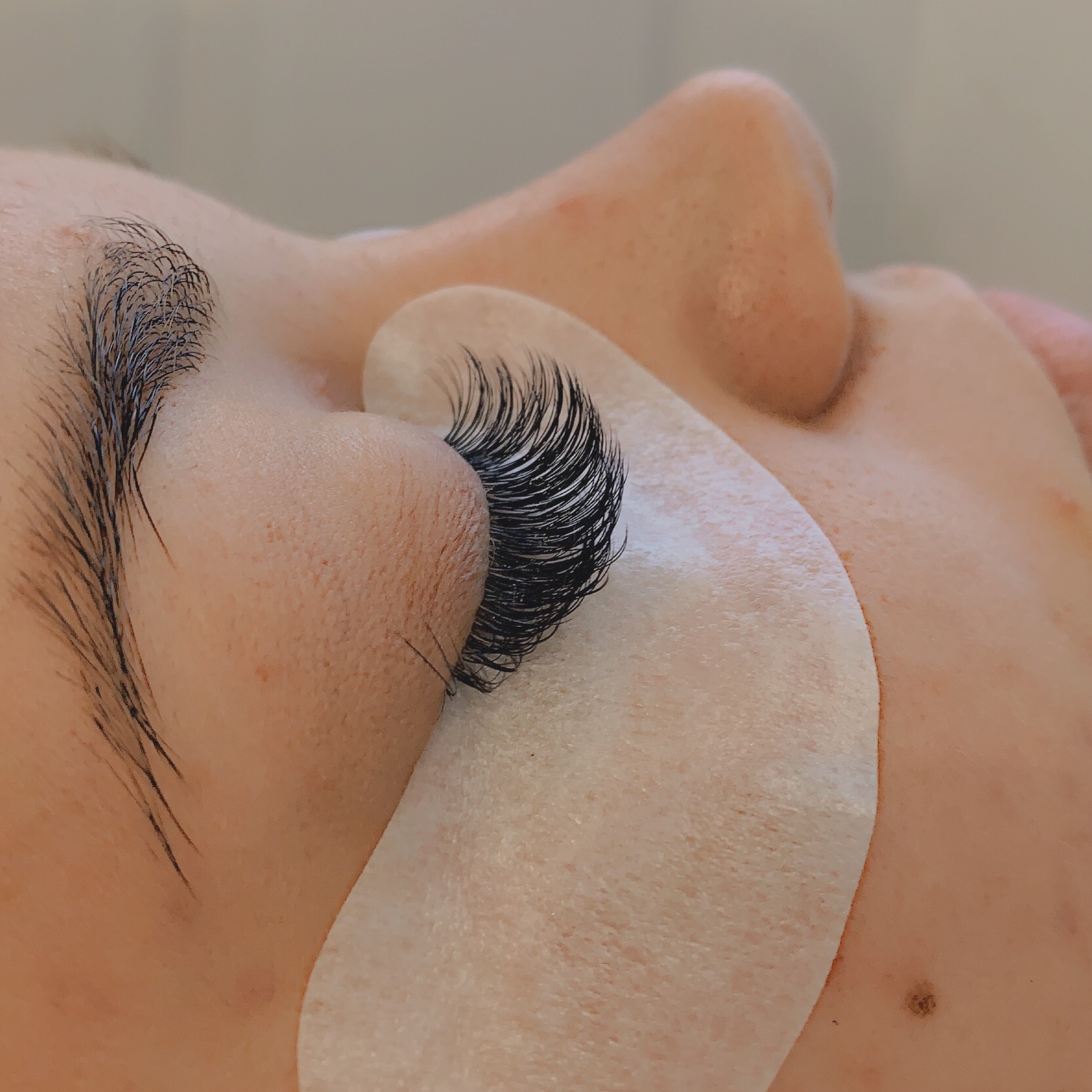 eye closed with eyelash extensions tape